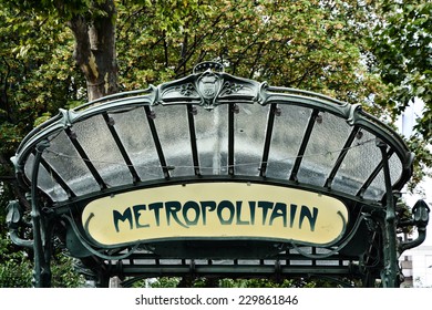 Typical Parisian metro sign by entrance in subway, art nouveau style in Paris, France - Powered by Shutterstock