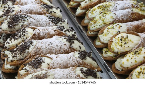 typical pastries for sale in the pastry shop of the region of Sicily in Southern Italy called CANNOLI SICILIANI in Italian language