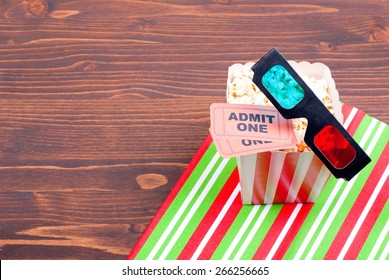 Typical Popcorn In A Glass With Two Movie Tickets And 3D Glasses, Place For Text, Top View