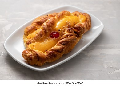 Typical Portuguese Sweet Bread With Cream On The Dish On Gray