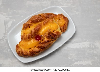 Typical Portuguese Sweet Bread With Cream On The Dish On Gray