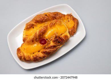 Typical Portuguese Sweet Bread With Cream On The Dish On Gray