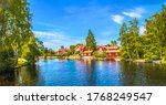 typical red swedish houses near by the pond