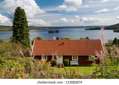 Typical Red Wooden House In Sweden