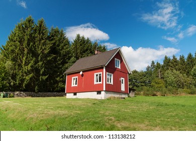 Typical Red Wooden House In Sweden