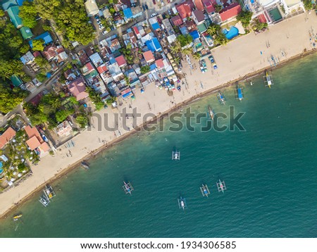 A typical resort town in the Philippines with buildings right up to the edge of the coastline. At Calayo, Nasugbu, Batangas.