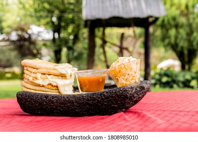 typical Salvadoran dish, cheese pupusas with cabbage and tomato sauce. rice and corn pupusas stuffed with cheese, beans or other ingredients - Shutterstock ID 1808985010