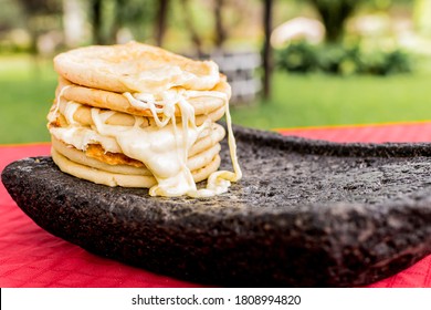 typical Salvadoran dish, cheese pupusas with cabbage and tomato sauce. rice and corn pupusas stuffed with cheese, beans or other ingredients - Shutterstock ID 1808994820