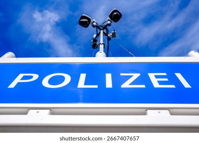 typical security barrier for a camera observation from the german police - translation: police