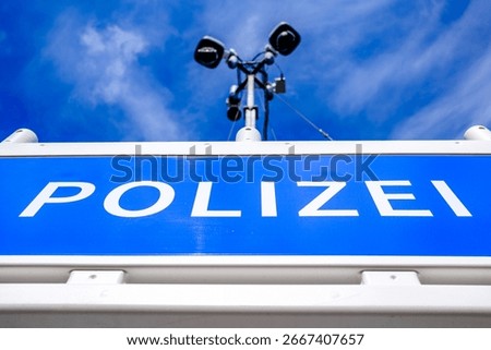 typical security barrier for a camera observation from the german police - translation: police