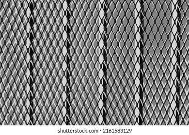 Typical Security Mesh Metal Screen For Protection From Criminal Activity In Black And White Film Negative.