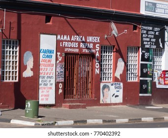 A Typical Small Beauty Salon, Fridge Repair Shop And Shoe Repairs In A Small South African Town. Main Road, Darling, Western Cape, South Africa, December 7, 2017