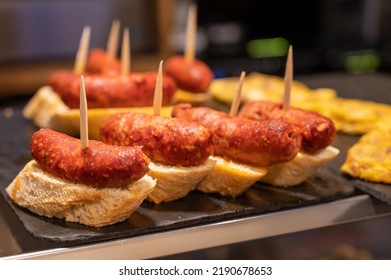 Typical snack in bars of Basque Country pinchos or pinxtos, small slices of bread upon which ingredient or mixture of ingredients is placed and fastened with toothpick, San Sebastian, Spain, close up
