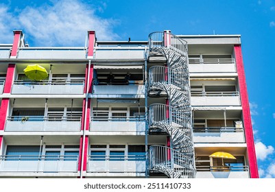 typical spiral staircase - emergency exit at a apartment building in austria - Powered by Shutterstock