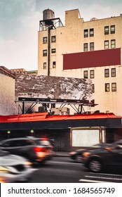 Typical Street Corner Scene In New York With Rush Hour Car Traffic And Blank Or Empty Advertising Surfaces And Billboards For Your Design, Closed Shop Or Store Front, Real 35mm Film Photo.