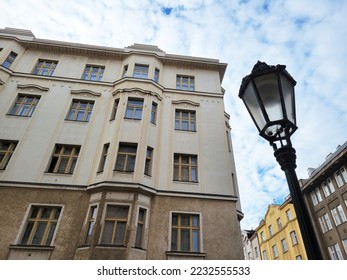 Typical street in old Prague, Czech Republic.  Features a lamp post and facade of a five story building.  