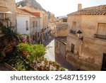 Typical street in the old town of Ricote, Murcia region, Spain, with golden morning light