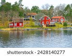 A typical Swedish red houses vith lake, Falu Rödfärg