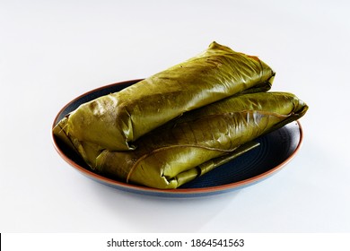 typical tamale wrapped in banana leaf