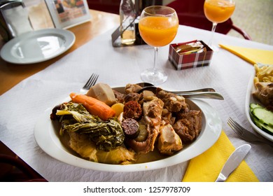 Typical And Traditional Azores Food Dish Or Dinner Prepared By Lowering The Pot In A Hot Spring Hole Heated By Volcanic Steam For More Than 5 Hours, Slow Cooking With A Lid Weighted With Stones On Top