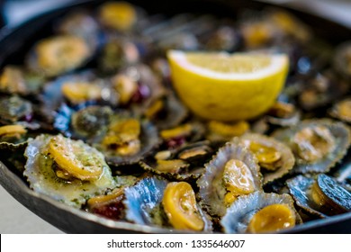 Typical And Traditional Food In Portugal, Madeira. Seafood (mussels) In A Hot Plate.