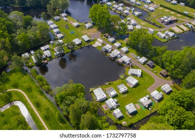 Typical traditiondutch way of spending the holyday / vacation. aerial drone view of caravan motor home camp site camp grounds camping.