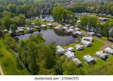 Typical traditiondutch way of spending the holyday / vacation. aerial drone view of caravan motor home camp site camp grounds camping.