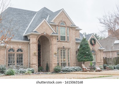 Typical two story house under winter snow cover near Dallas, Texas, USA