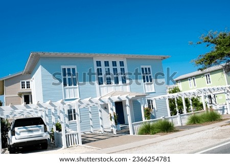 Typical two-story houses with white pergola, picket fence curb appeal along scenic 30A country road in Santa Rosa, South Walton, Destin, Florida Panhandle. Residential vacation homes clear blue sky Stock photo © 