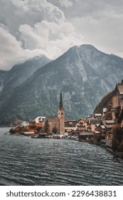A typical view of Hallstatt and Lake Hallstatt, with high mountains in the background. - Shutterstock ID 2296438831