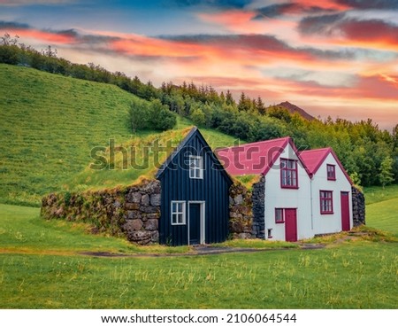 Typical view of Icelandic countryside architecture. Impressive summer sunrise in Skogar village, South Iceland, Europe. Traveling concept background.