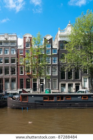 Similar – Schöne Architektur niederländischer Häuser und Hausboote am Amsterdamer Kanal im Herbst