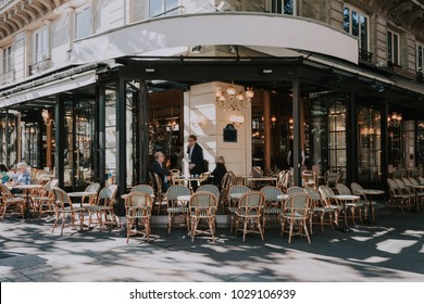 Typical view of the Parisian street with tables of brasserie (cafe) in Paris, France. Architecture and landmarks of Paris. Postcard of Paris - Shutterstock ID 1029106939