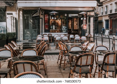 Typical View Of The Parisian Street With Tables Of Brasserie (cafe) In Paris, France. Architecture And Landmarks Of Paris. Postcard Of Paris