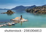 Typical view of Vlacherna Monastery and Mouse island with airplane landing, Corfu, Greece.