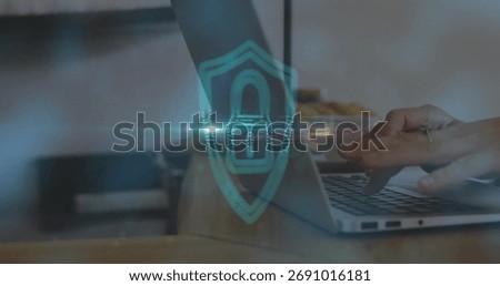 Typing hands securing network on wooden desk at office, with laptop shield overlay and pastries. Technology, cybersecurity, innovation, workspace, digital, protection, professionalism