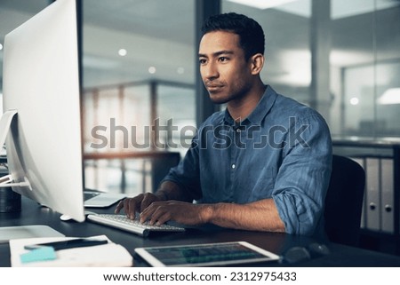 Typing, man and programmer on computer in office at night for deadline. IT, focus and male coder, engineer or person programming, coding and writing software, development and information technology.