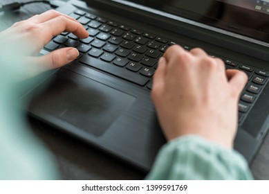 Typing on black Laptop on black Desk, Home Office, Mobile Work