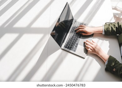 Typing on keyboard Working online on laptop computer On a white table at the office. Facebook chat. Web meeting. Blogger. Journalist writing an article. online job ideas - Powered by Shutterstock