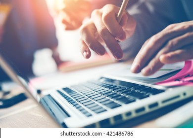 Typing on laptop close-up. Meeting report in progress. Film effect, blurry background - Shutterstock ID 421486786