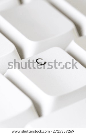 Typing and text input concept with a white C key