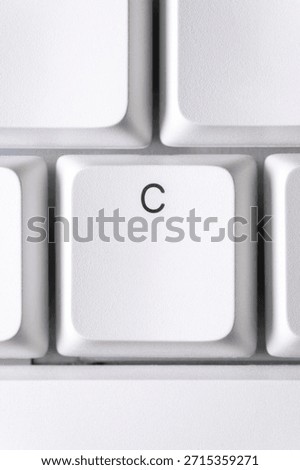Typing and text input concept with a white C key
