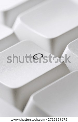 Typing and text input concept with a white C key