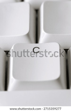 Typing and text input concept with a white C key