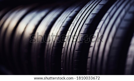 Tyre background concept. Stack of tires with selective focus
