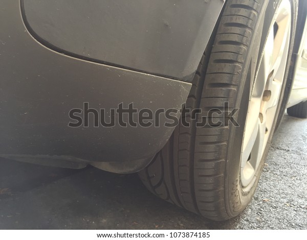 Tyre of Black car\
and bumper of car Close up