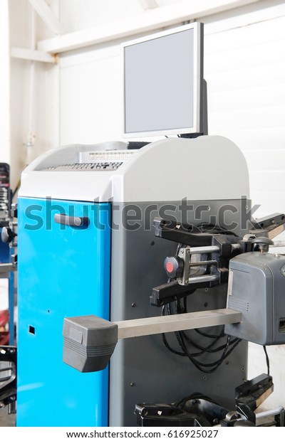 tyre fitting\
machines in a car repair\
station