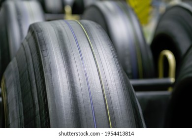 Tyre Manufacturing Production In Factory Warehouse, Green Tire Radial, Extruded Rubber Layers Preparing To Mold For The Curing Process, Car Logistic Transportation Industry