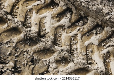 Tyre Mark Background. Tire Track Shape. Trail Lines On Dry Brown Sand Pattern. Road Construction Site Backdrop. Heavy Machinery Imprint. Dried Mud Vehicle Wheel Shape.