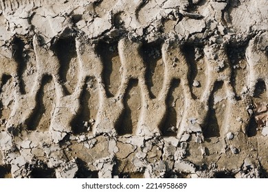 Tyre Mark Background. Tire Track Shape. Trail Lines On Dry Brown Sand Pattern. Road Construction Site Backdrop. Heavy Machinery Imprint. Dried Mud Vehicle Wheel Shape.